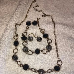 Necklace, bracelet and earrings set in gold, silver, and black